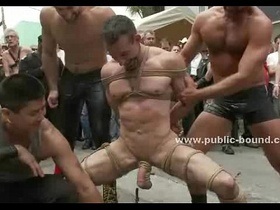 Kinky gay boy in ropes kneels down